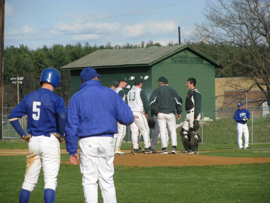 Green meeting on the mound, blue on the base paths